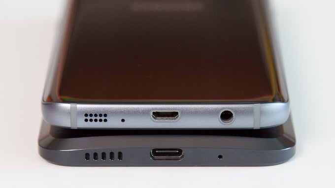 Samsung Galaxy S7 on top with the old microUSB port and HTC 10 below, with the new and reversible USB-C - 5 reasons why you should get the HTC 10 over the Samsung Galaxy S7