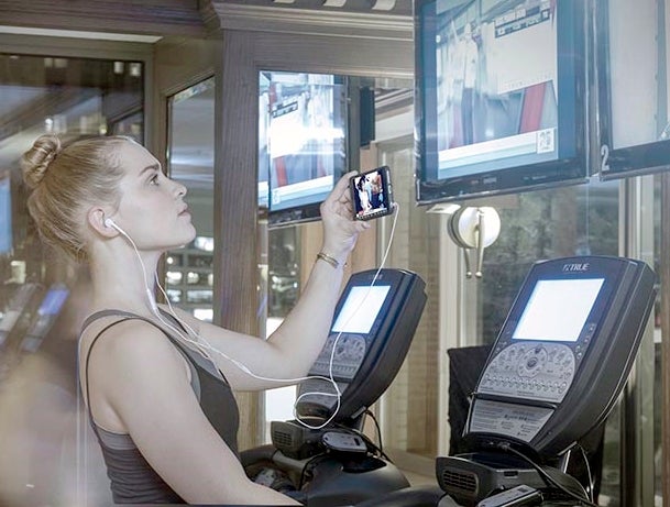 Using Tunity inside the gym. - Tunity lets you hear the audio from muted TVs in airports, bars, and gyms from your Android or iOS smartphone