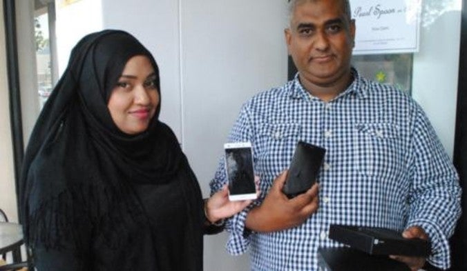 Huawei&#039;s Hawa Hyath (L) presents Siraaj Abrahams with a Huawei P9 lite - Huawei P8 lite takes two bullets for its owner; company responds with a free upgrade to the P9 lite