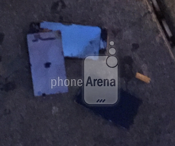 The remains of a burnt Apple iPhone 6s lie on the street after the phone exploded in our reader's back pocket - Apple iPhone 6s catches on fire