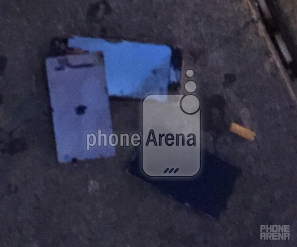 The remains of a burnt Apple iPhone 6s lie on the street after the phone exploded in our reader&#039;s back pocket - Apple iPhone 6s catches on fire