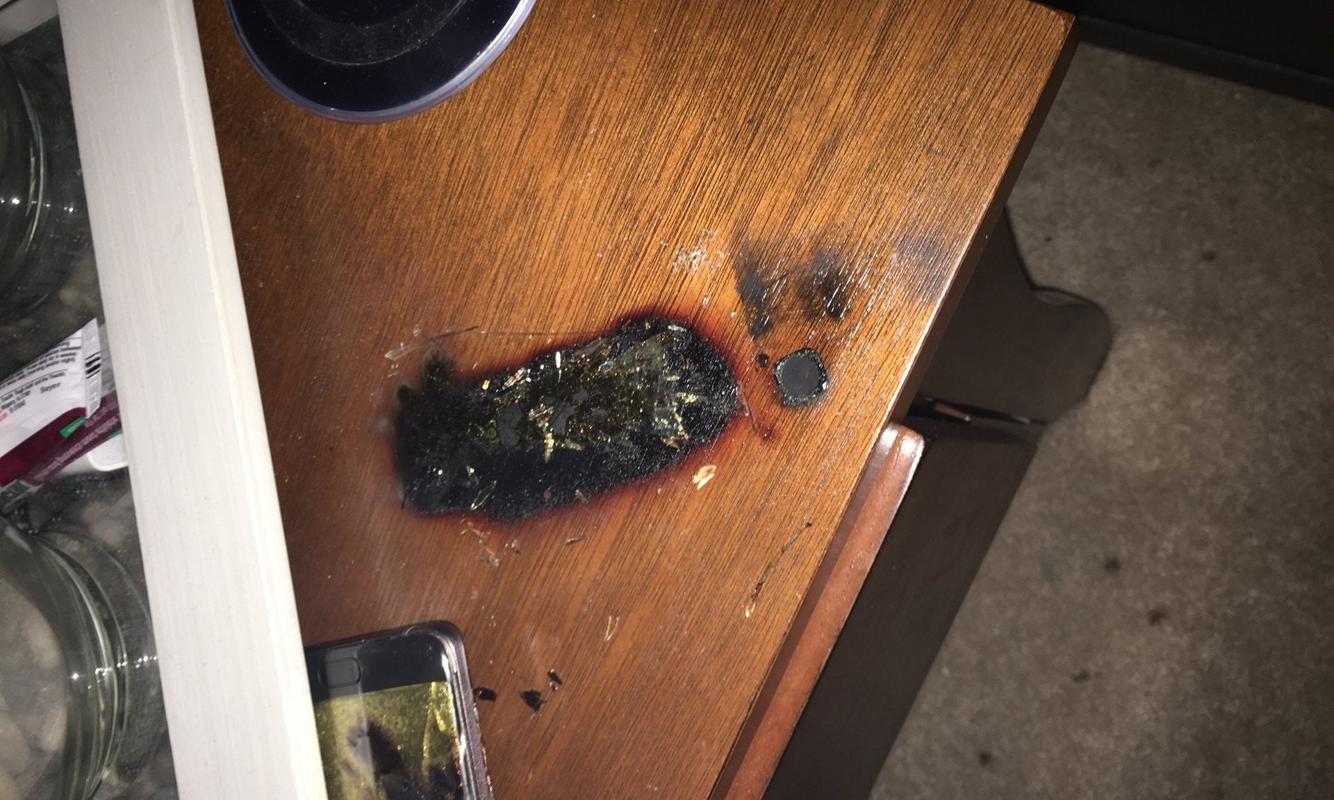 Shawn Minter's nightstand damaged by the explosion of his Galaxy Note 7 - Samsung won't pay for any damages caused by Galaxy Note 7 explosions