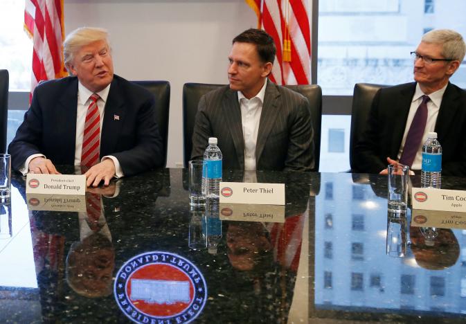 Trump supporter and Hedge Fund manager Peter Thiel sits in between the President-elect and Apple CEO Tim Cook during Wednesday&#039;s tech summit in New York - Tech executives have &quot;productive&quot; meeting with the President-elect and his family on Wednesday