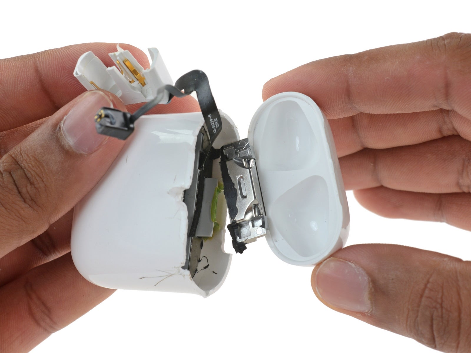 The charging case was completely destroyed before it opens. - AirPods Teardown: Impossible to repair or recycle