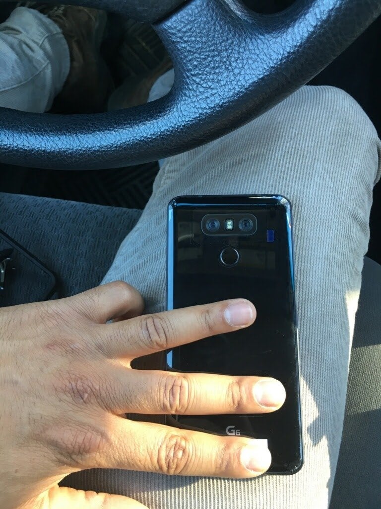 Click to zoom in - Photo of the LG G6 in the wild shows its glossy back