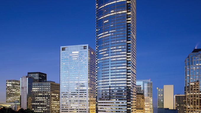 Two Union Square (right) - the home of Apple's Seattle office - Apple is enlarging its Seattle engineering center to focus on machine learning and AI