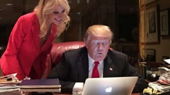 Mr. Trump looking at a computer - Donald Trump now uses an iPhone