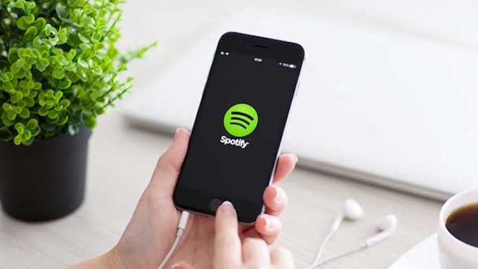 Spotify might be nearing an IPO, as the company settles a lawsuit and hires new talent