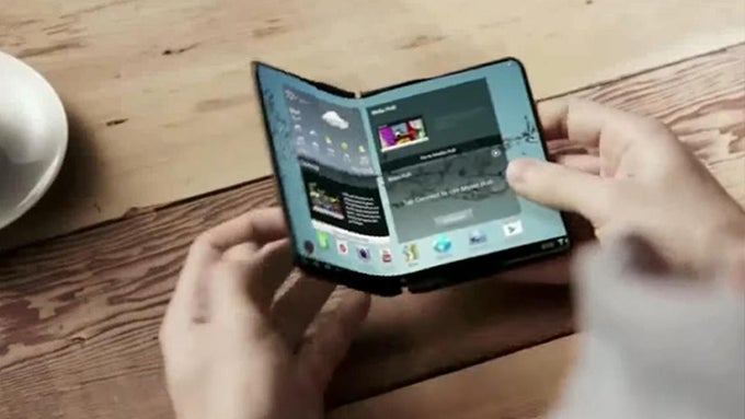 A still from an old Samsung ad showcasing a foldable smartphone concept - Samsung seems to be rushing the development of its foldable smartphone, but why?