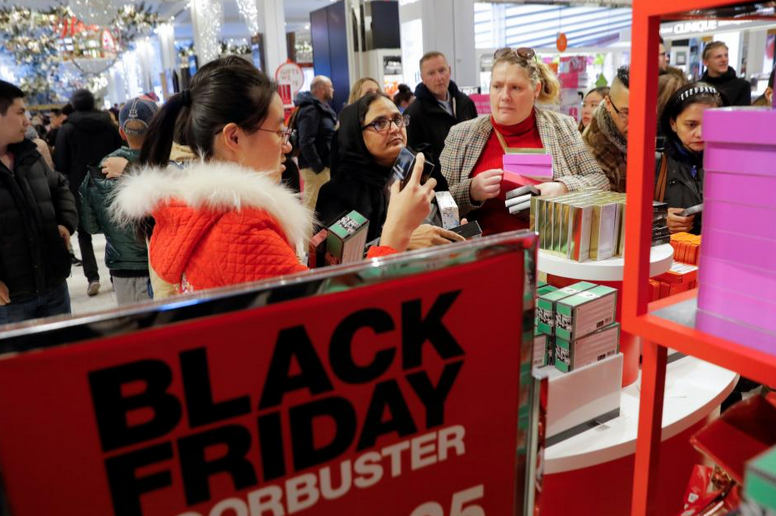 Slowly becoming a rarity, shoppers show up at Macy's in Herald Square - Mobile shopping expected to drive record online sales figures today for Cyber Monday in the U.S.
