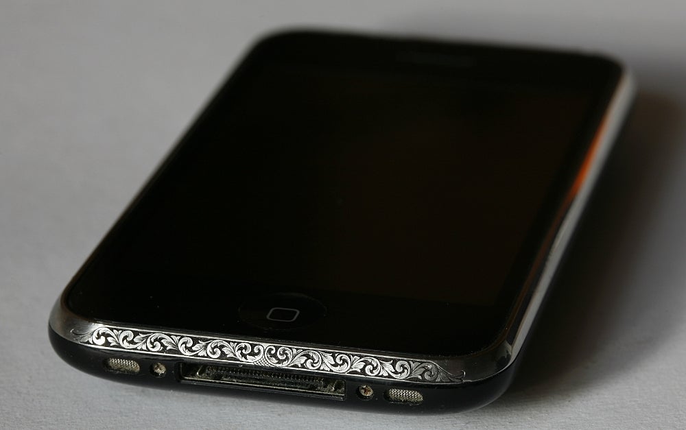 Personalized hand-engraving adds some elegance to an older iPhone