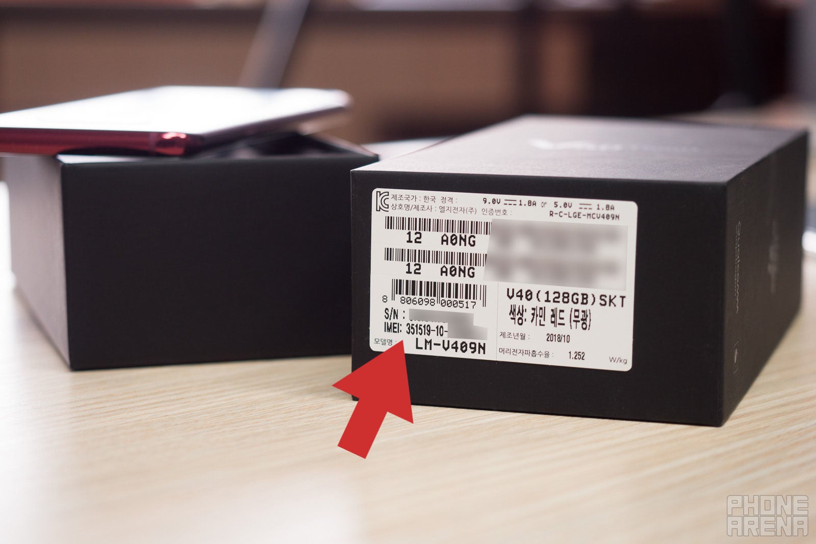 (Image credit - PhoneArena) Checking the IMEI number on a phone's retail box - How to Find a Phone's IMEI Number: A Step-by-Step Guide