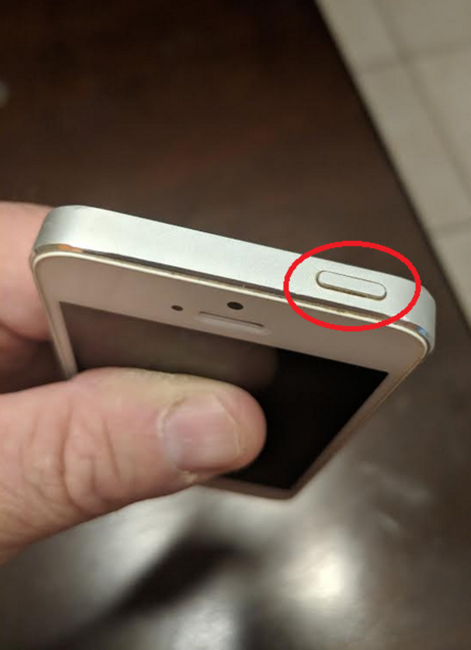 The sleep/wake button on the Apple iPhone 5 - Suit claims that Apple sold older iPhone units with a defective key part