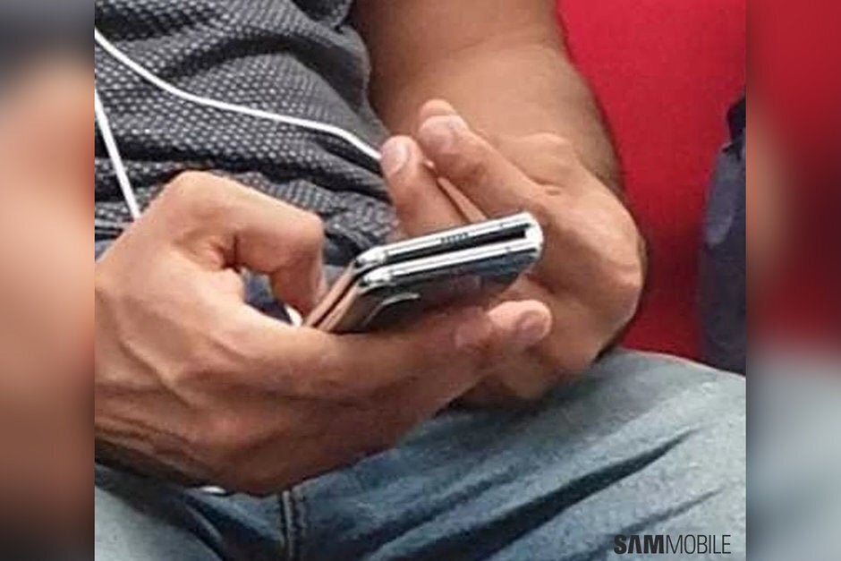 A New Delhi metro rider holds the improved Samsung Galaxy Fold - Samsung executive says there is no new Galaxy Fold launch date on the horizon