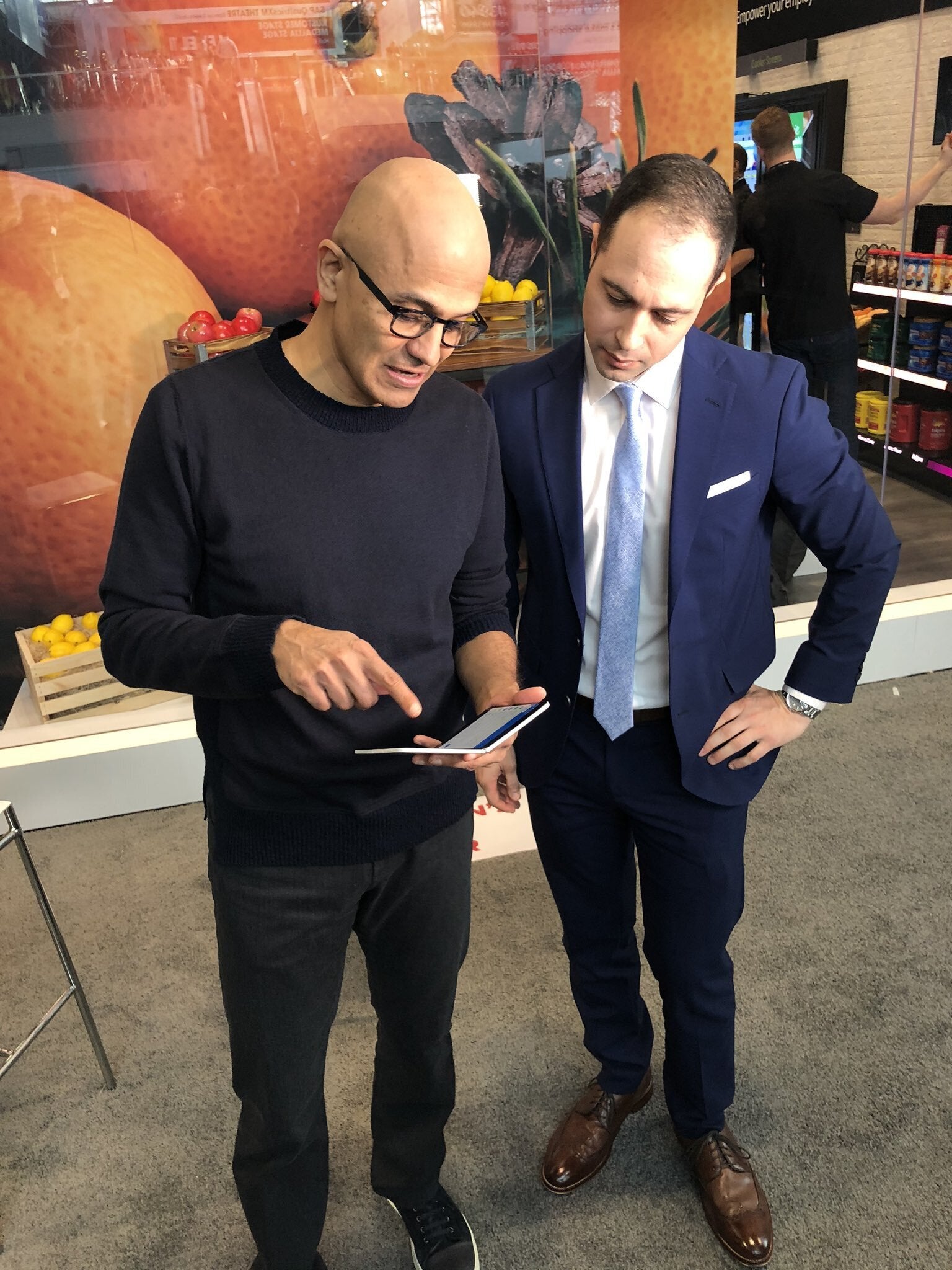 Microsoft CEO Satya Nadella showing off his Surface Duo device - Dual-screened Surface Duo gets photo opp with Microsoft's CEO Nadella