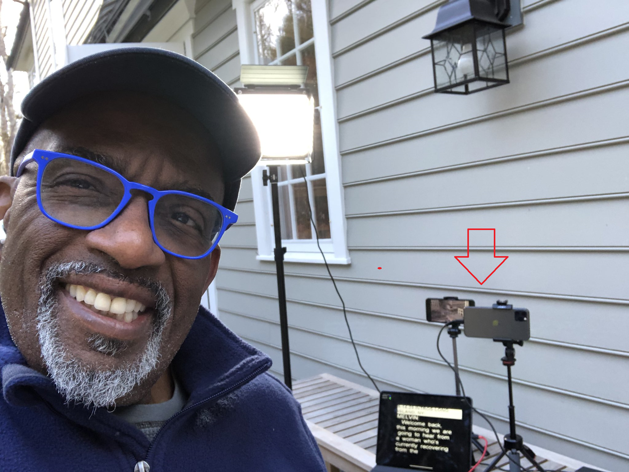 NBC's Al Roker poses with the iPhone units and the iPad he uses to broadcast live from outside his home - Three iOS devices allow Al Roker to broadcast live from home