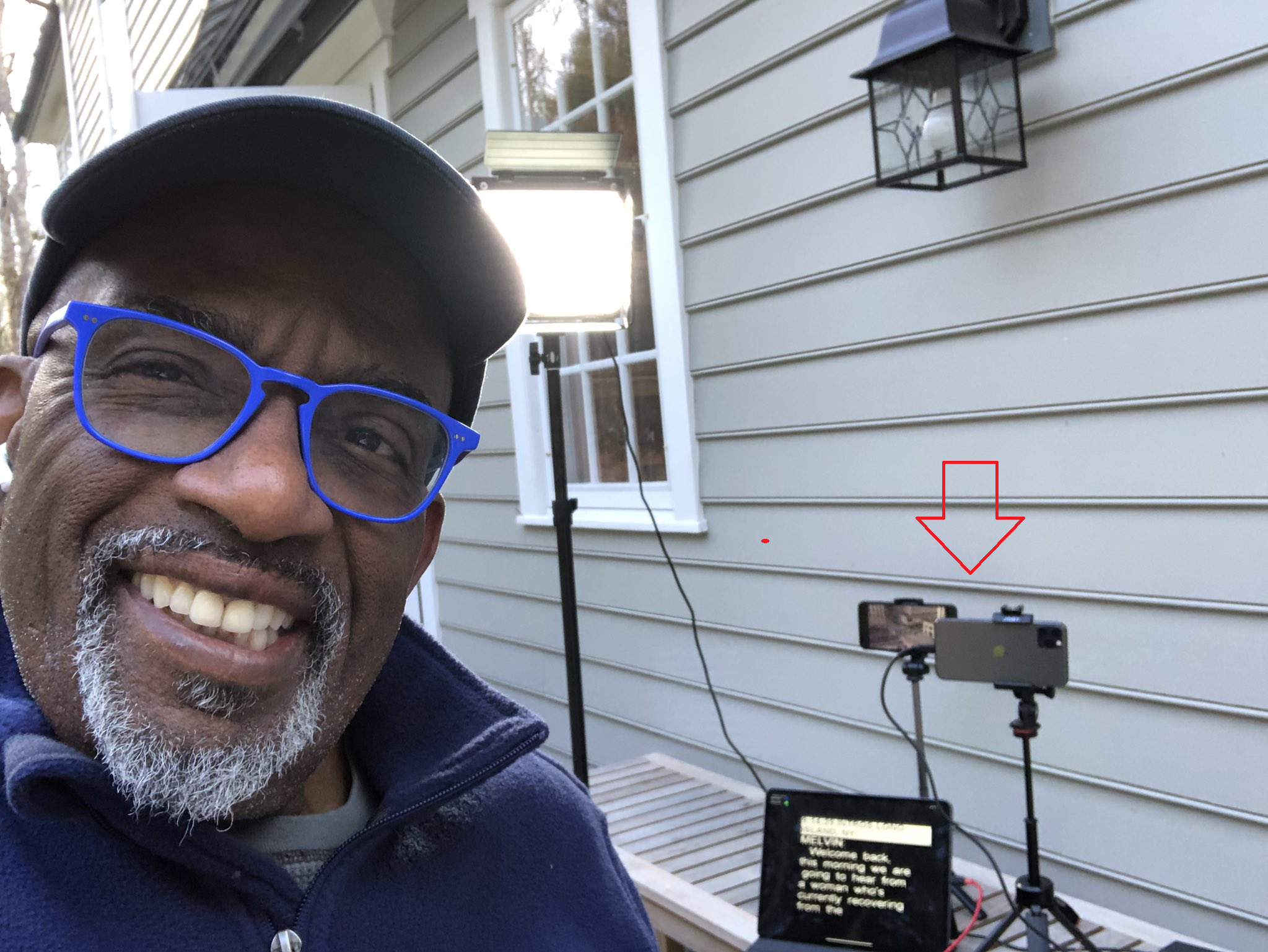 NBC&#039;s Al Roker poses with the iPhone units and the iPad he uses to broadcast live from outside his home - Three iOS devices allow Al Roker to broadcast live from home