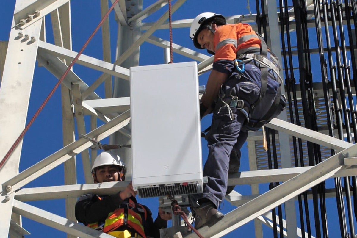 Ericsson engineers work on a cell tower - U.S. still looking at ways to create a challenger to Huawei for 5G gear