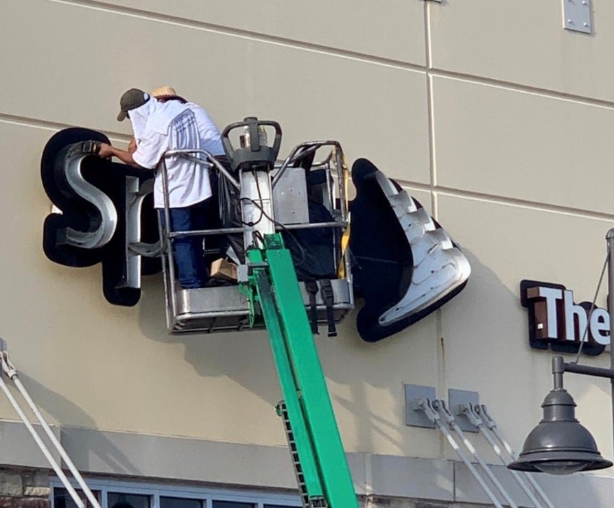 The Sprint name comes off one of its former stores - T-Mobile starts to close and rebrand Sprint stores says its construction director