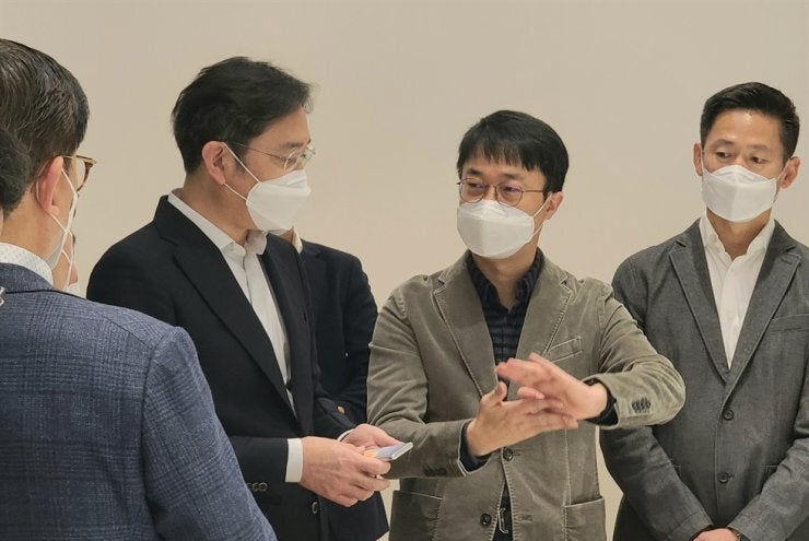 Samsung&#039;s Vice Chairman Lee Jae-yong seen with a device presumed to be its rollable prototype - Samsung may have just teased its rollable phone