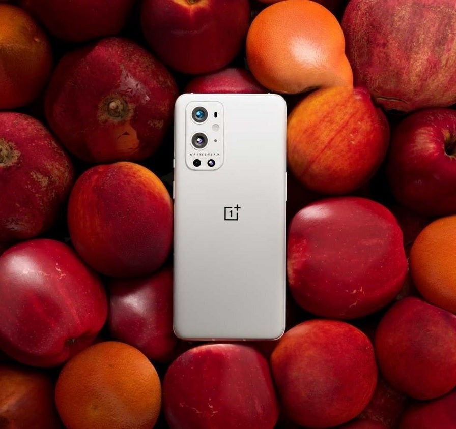 OnePlus takes a shot at Apple with this promo photo of the OnePlus 9 Pro - OnePlus' 5G &quot;forbidden fruit&quot; photographed taking a shot at the iPhone