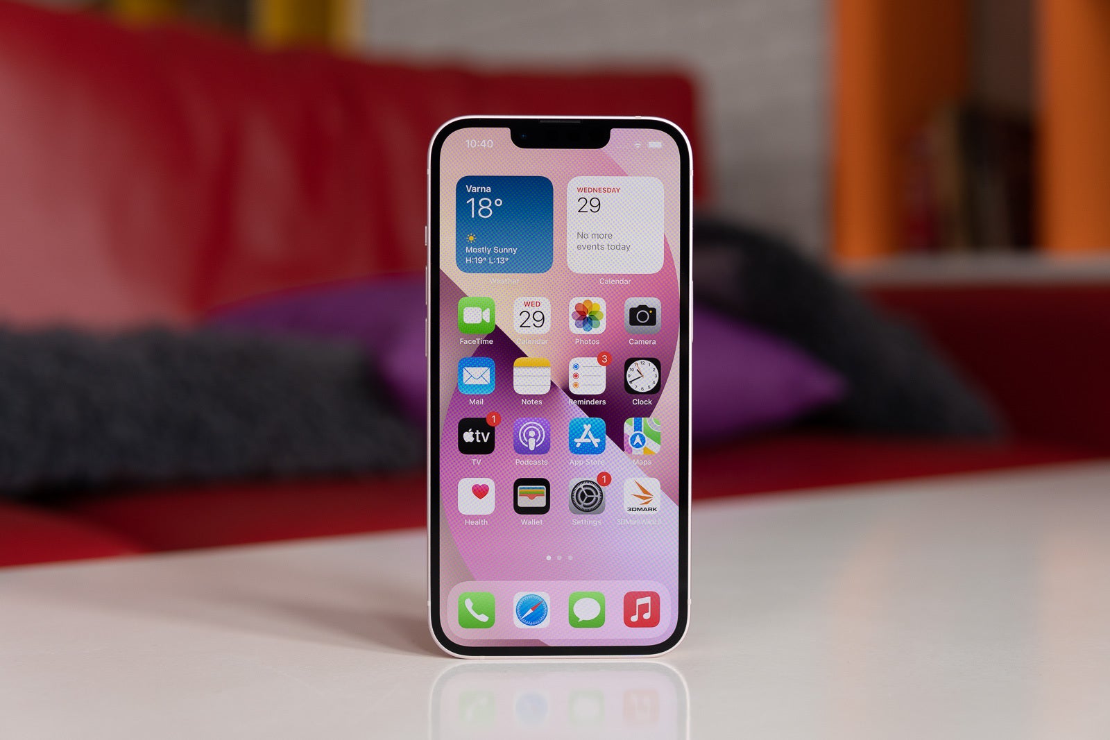 The iPhone 13 (shown here) has little to differentiate itself from the iPhone 12 – a diagonal back camera and a more narrow notch - Apple, why is the OLED iPhone 13 still missing always-on display?