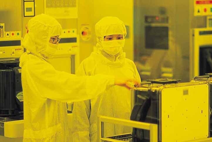 TSMC employees inside a 12-inch wafer fab - U.S. demands data from Apple chipmaker TSMC