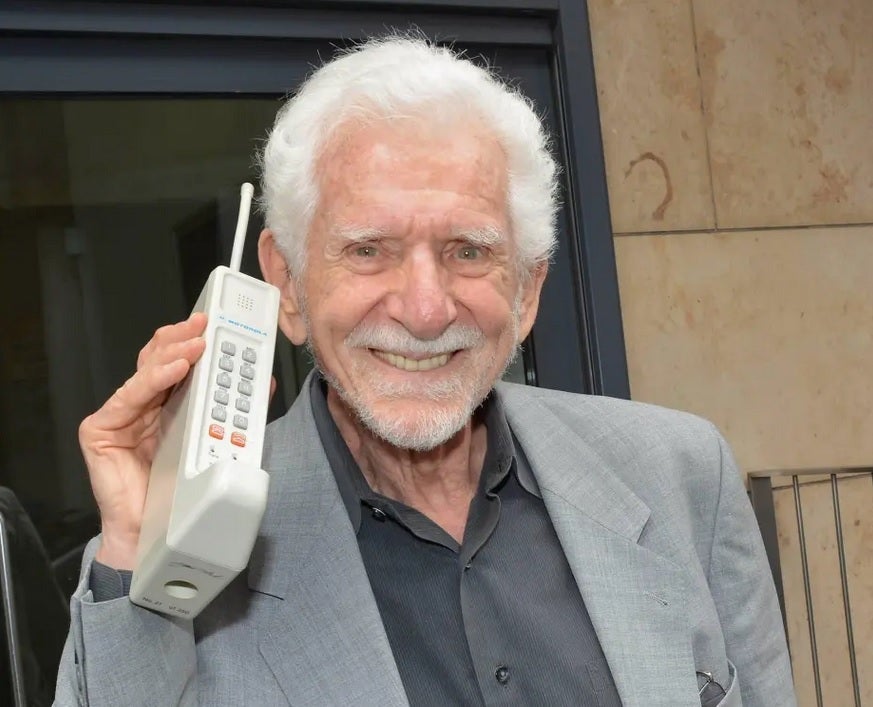 Cellphone inventor Marin Cooper in 2014 with the Motorola DynaTAC 80000X - Cellphone inventor tells user to "get a life!"