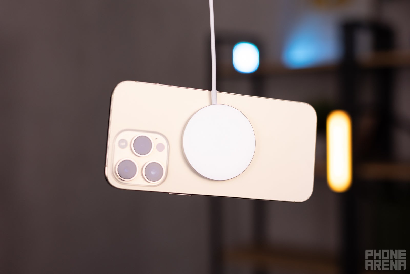 An iPhone 14 charging wirelessly with a magnetic MagSafe charger (and it&#039;s in mid-air, because why not?) - iPhone 14 and 15: Apple is finally conforming with the competition (against its will), and I&#039;m all for it