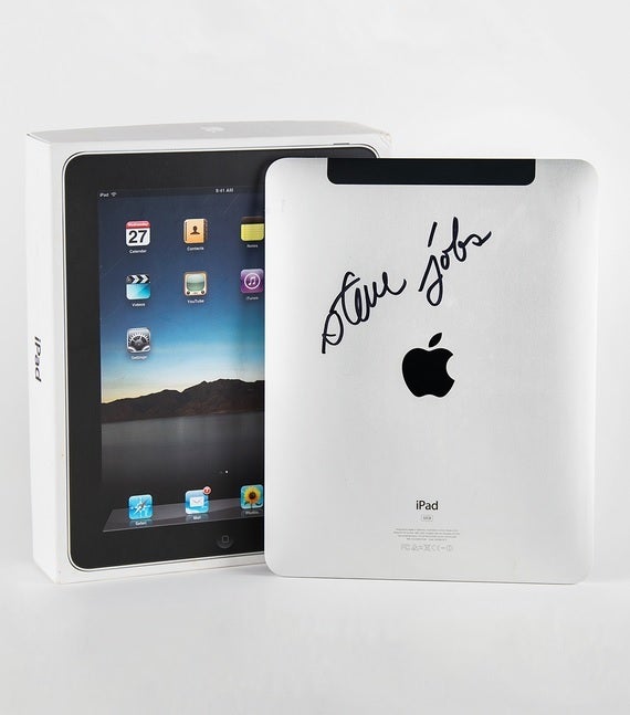 Apple iPad autographed on the back panel by Steve Jobs - 2010 iPad signed by Jobs, a 2007 "Holy Grail" iPhone among Apple devices being auctioned off