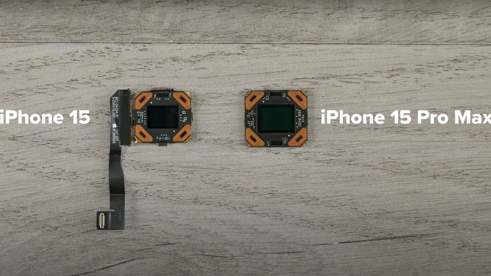 iPhone 15 (1/1.56&quot; sensor) vs iPhone 15 Pro Max (1/1.28&quot; sensor) main camera sensor sizes - Close-up image shows significant size difference between iPhone 15 and Pro Max&#039;s 48MP cameras