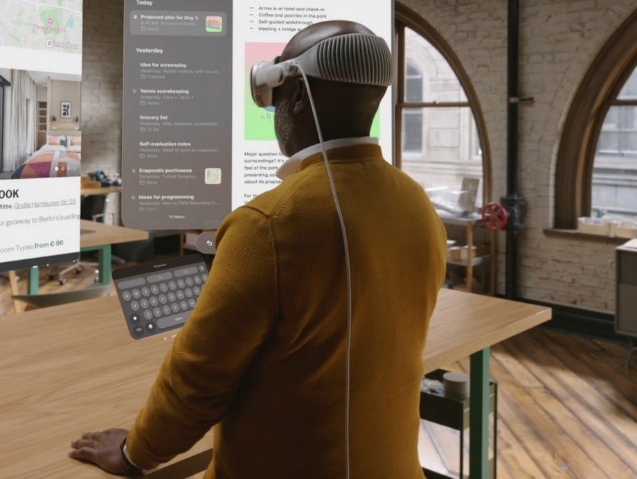 Photo taken by Apple shows the battery cord running down from the Vision Pro's headset - Belkin to have Vision Pro accessory ready to go on launch day