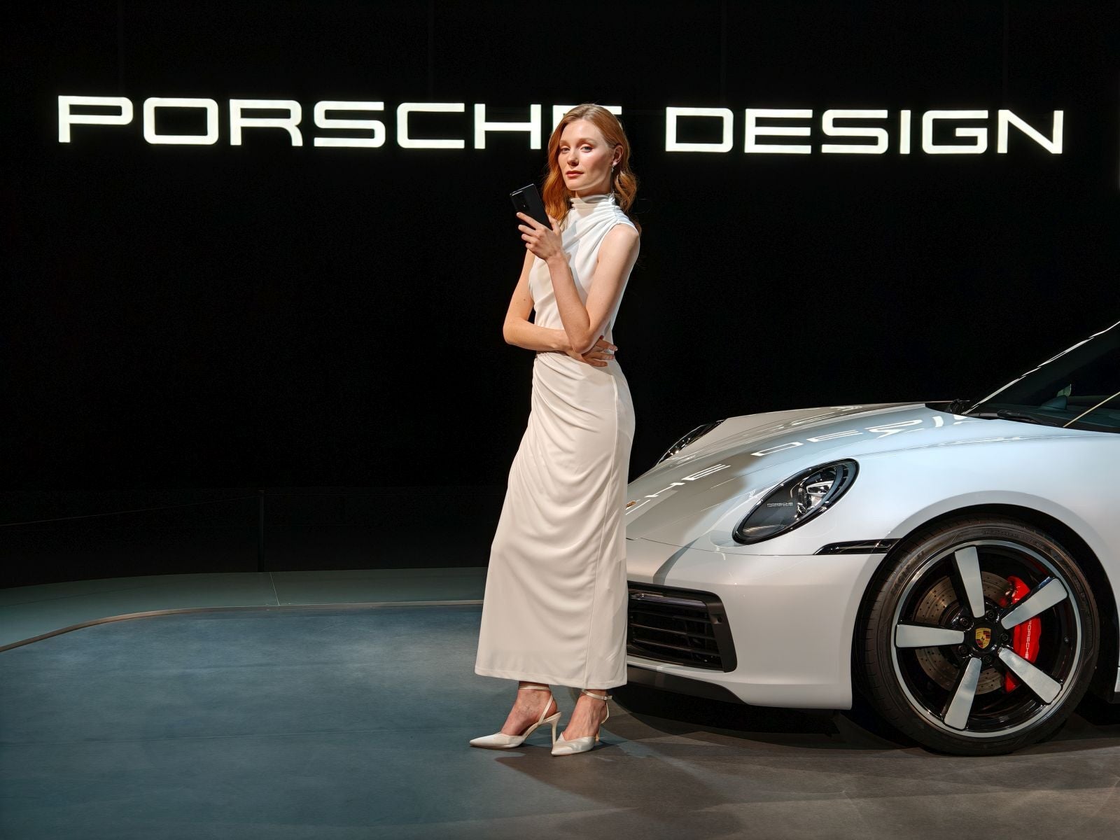 The Porsche Design Magic V2 RSR next to a 911 - Best of MWC 2024: Smart rings, AR glasses, and see-through screens