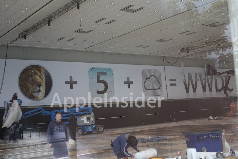 This banner, displaying the new iOS icon for Apple&#039;s soon-to-be-introduced iCloud service, hangs over the Moscone Center, home to Apple&#039;s WWDC - Analyst says that Apple&#039;s iCloud could seriously damage RIM