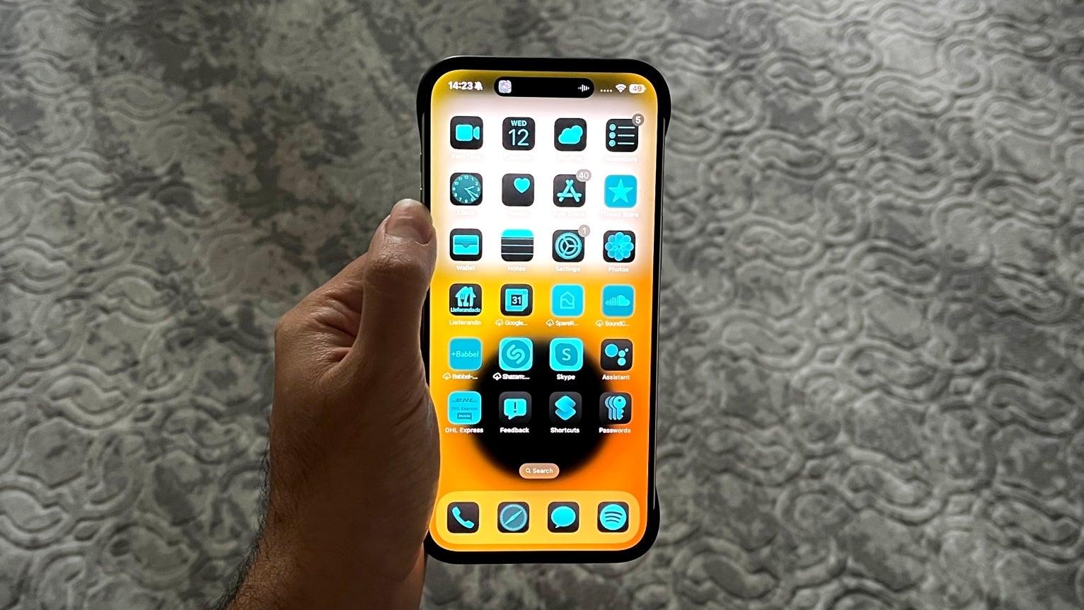 My iOS 18 home screen with blue-tinted icons. - iOS 18 turned my iPhone into a bad Android phone; proves why Apple refused to make the iPhone &quot;fun&quot;
