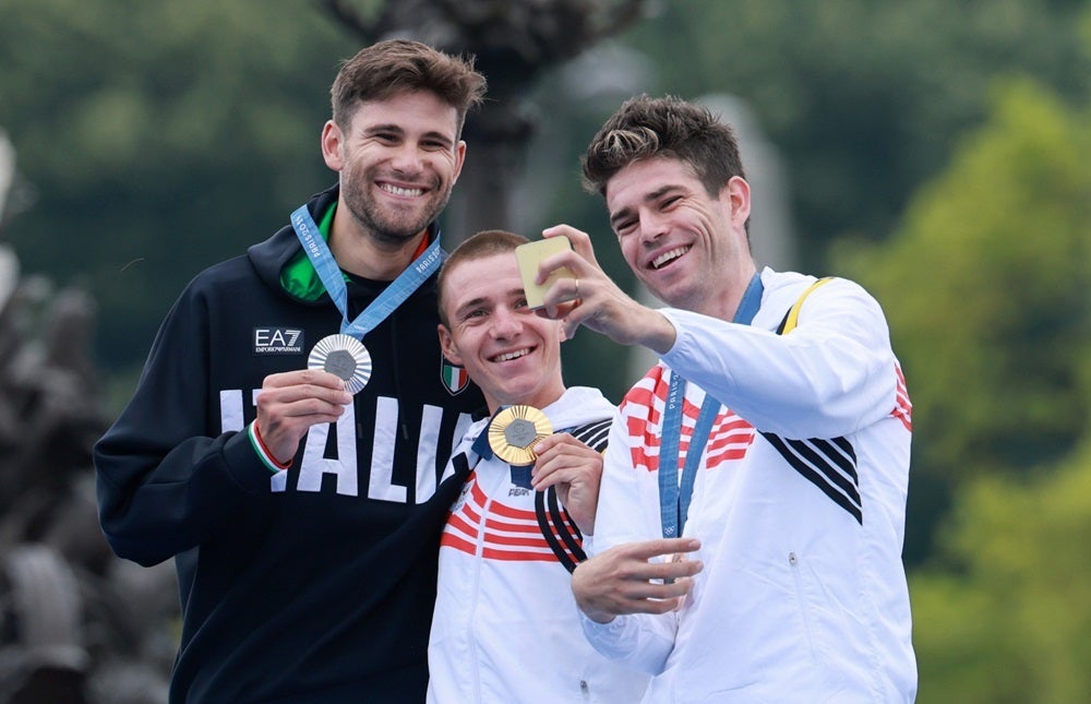 From left – Silver medalist Filippo Ganna of Team Italy and gold medalist Remco Evenepoel and bronze medalist Wout van Aert from Team Belgium pose for their Victory Selfie after the men’s individual time trial road cycling competition. | Photo by Jan Woitas, Getty Images - What is the Galaxy Victory Selfie, and why it&#039;s so darn hard to take one (Gallery)