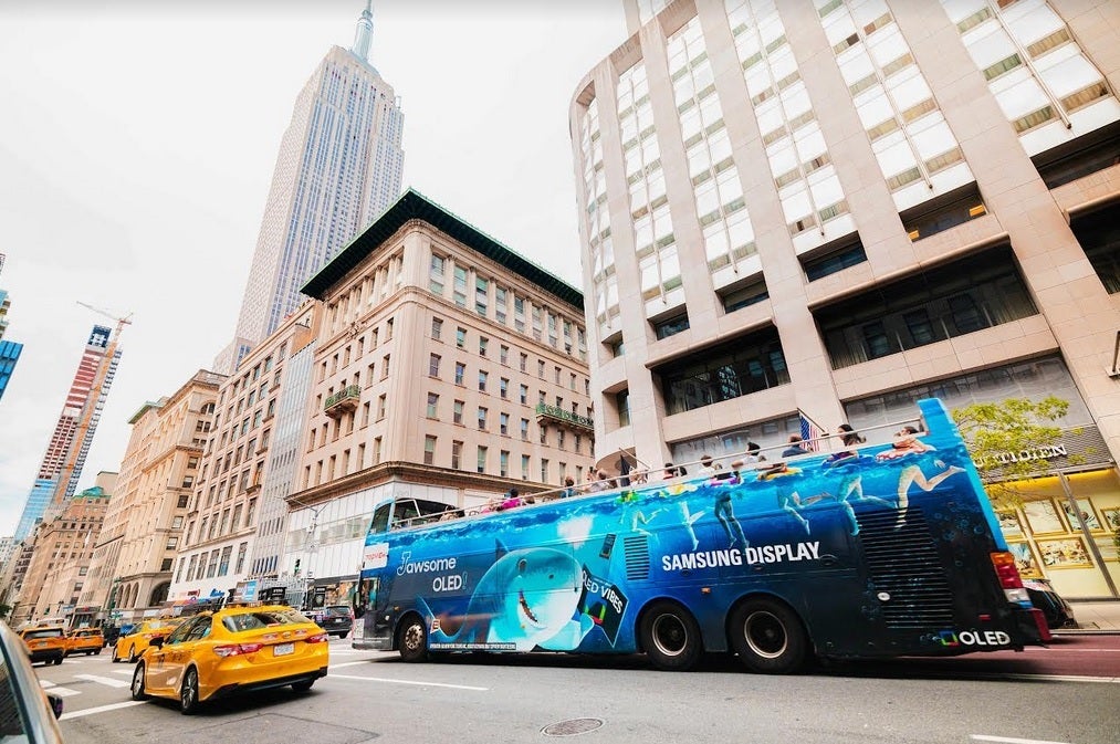 Samsung Display promotes a tri-foldable display on a NYC tour bus. | Image credit-Samsung - Huawei's tri-fold phone with 10-inch internal display to start mass production soon