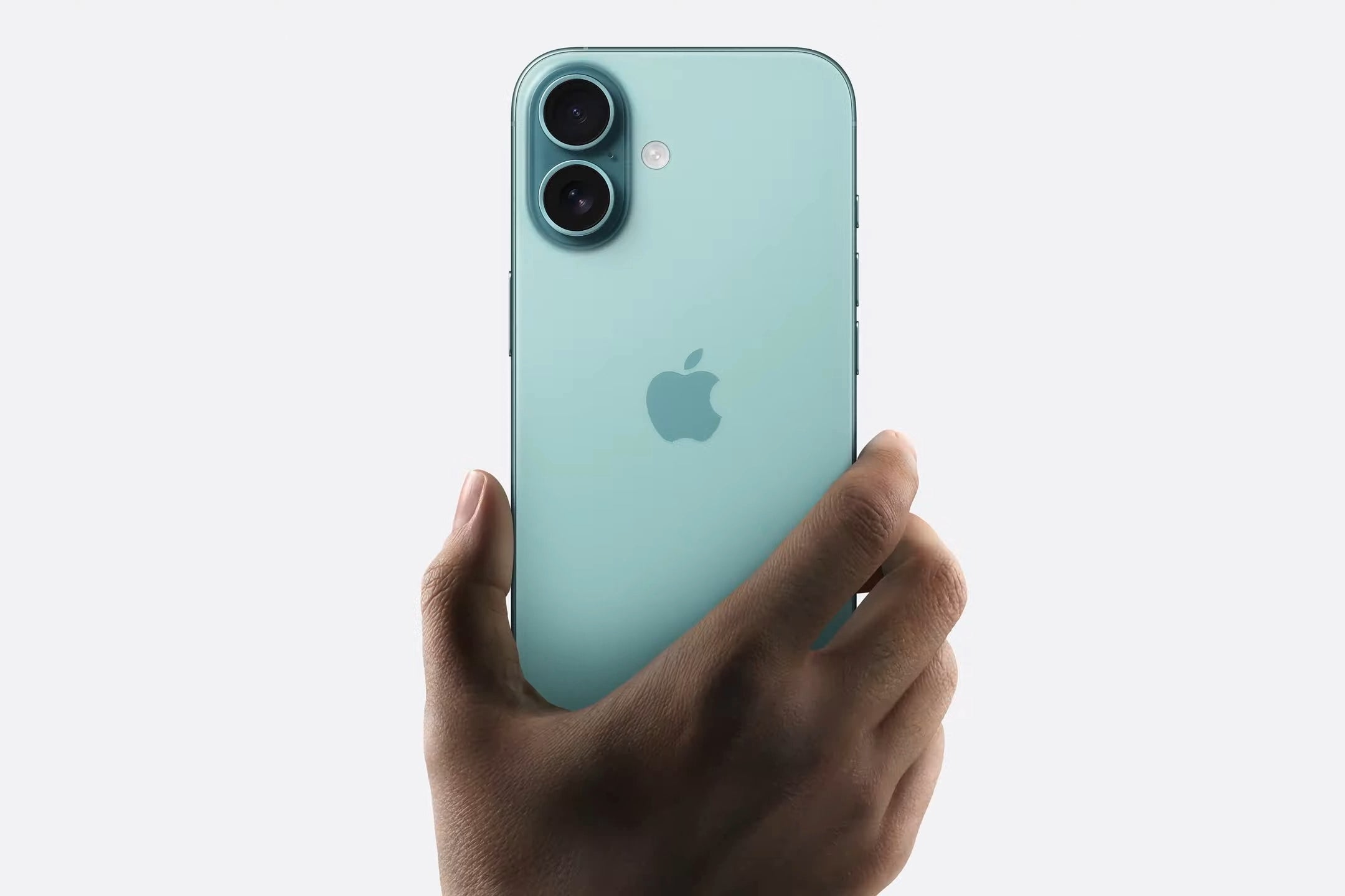 iPhone 16 in a person hand on a white background. 