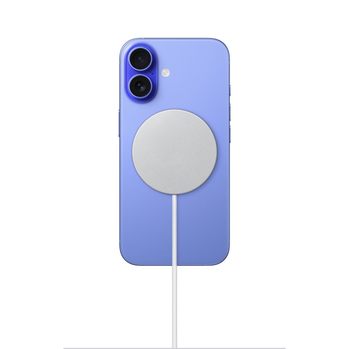 The MagSafe charger attached to a blue iPhone 16.