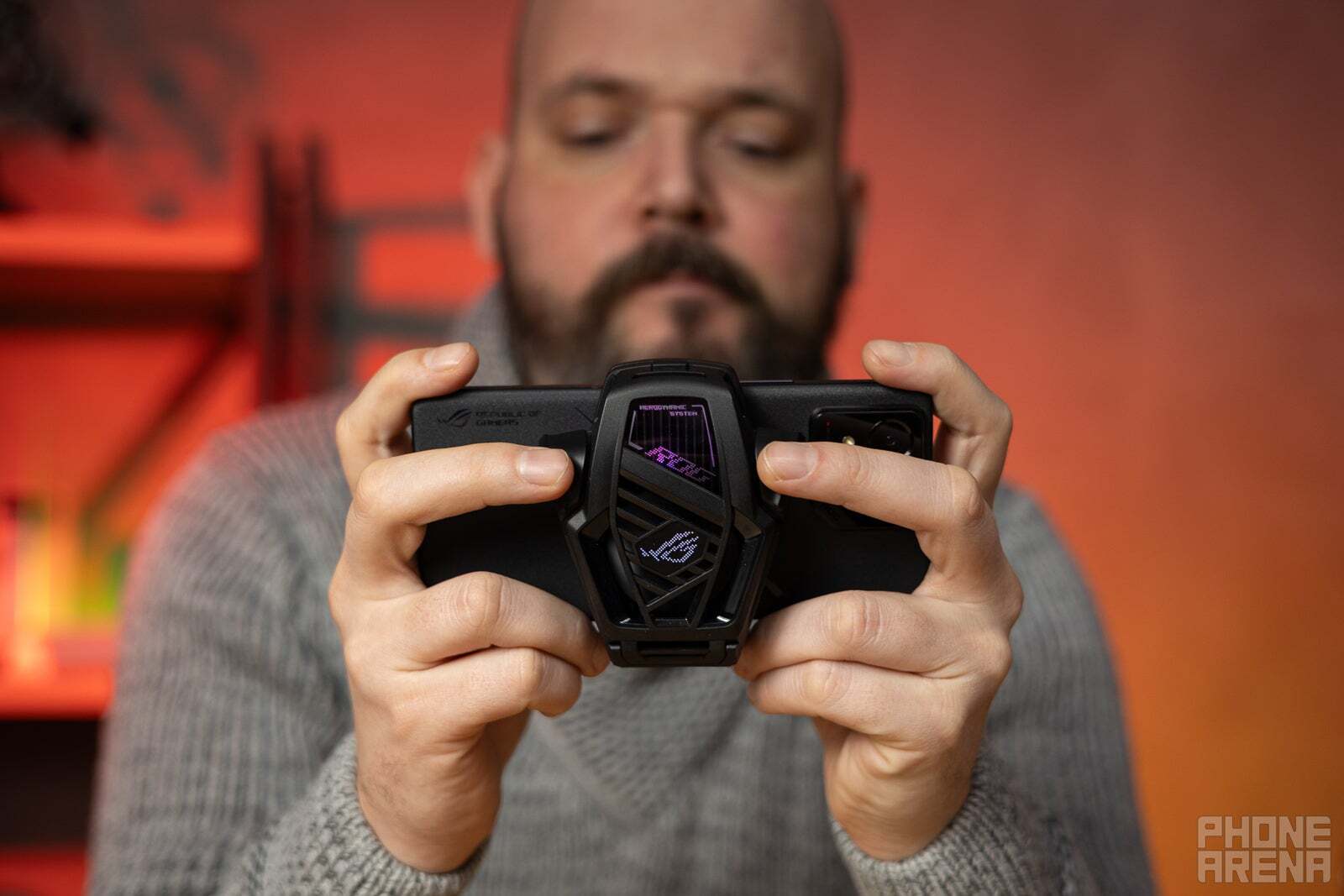 A person gaming on the Asus ROG Phone 8 Pro.