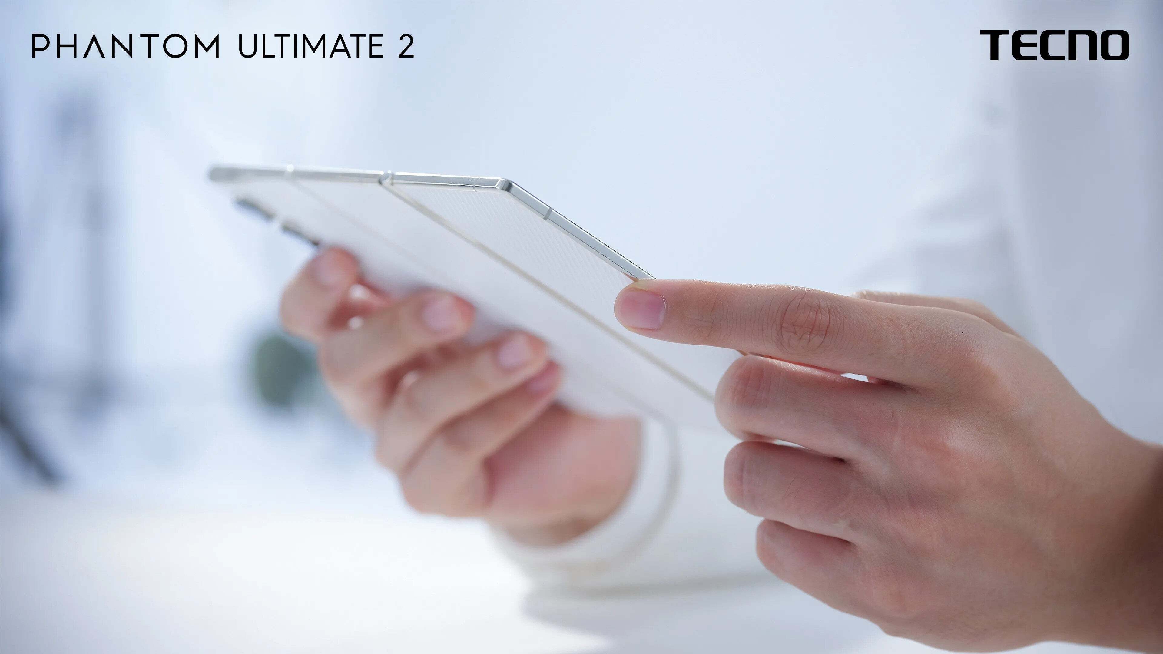 Tecno tri-foldable phone in white color held in a person&amp;#039;s hands.