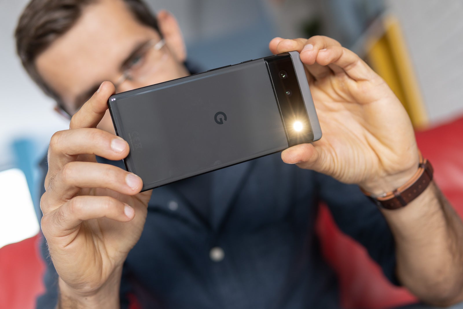 An image of a man taking a picture using a Google Pixel 6 series device