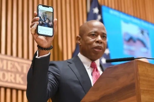 NYC Mayor Eric Adams shows off his Apple iPhone which was confiscated by the FBI last year.