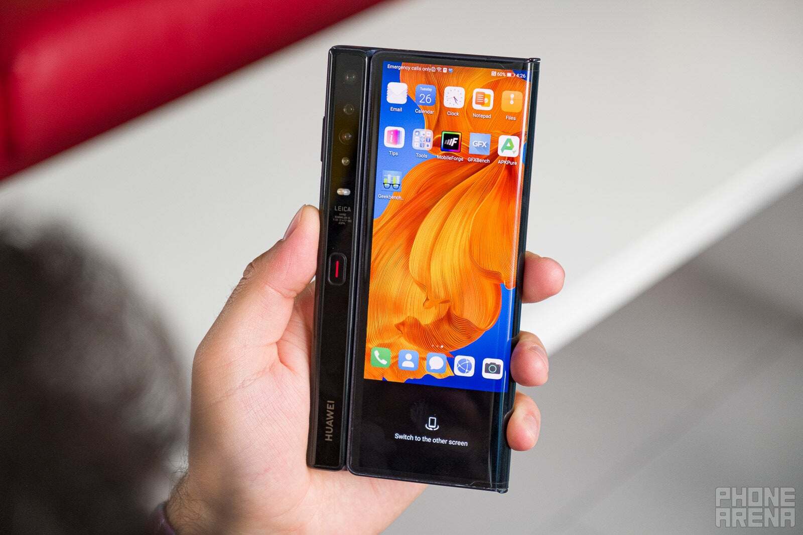 Huawei Mate XS had this red button in the center that would pop open the phone. Cool, but a bit weird and problematic in real world use (Image by PhoneArena) - The most important innovation in foldable phones this year