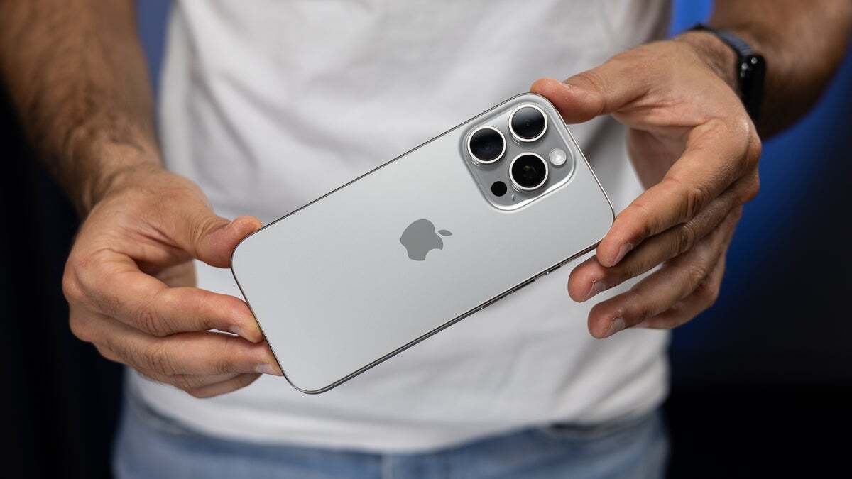 A person holding the iPhone 16 Pro.