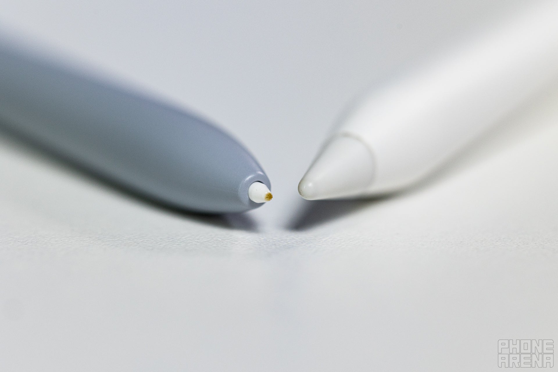 Closeup of the tips of the S Pen and Apple Pencil