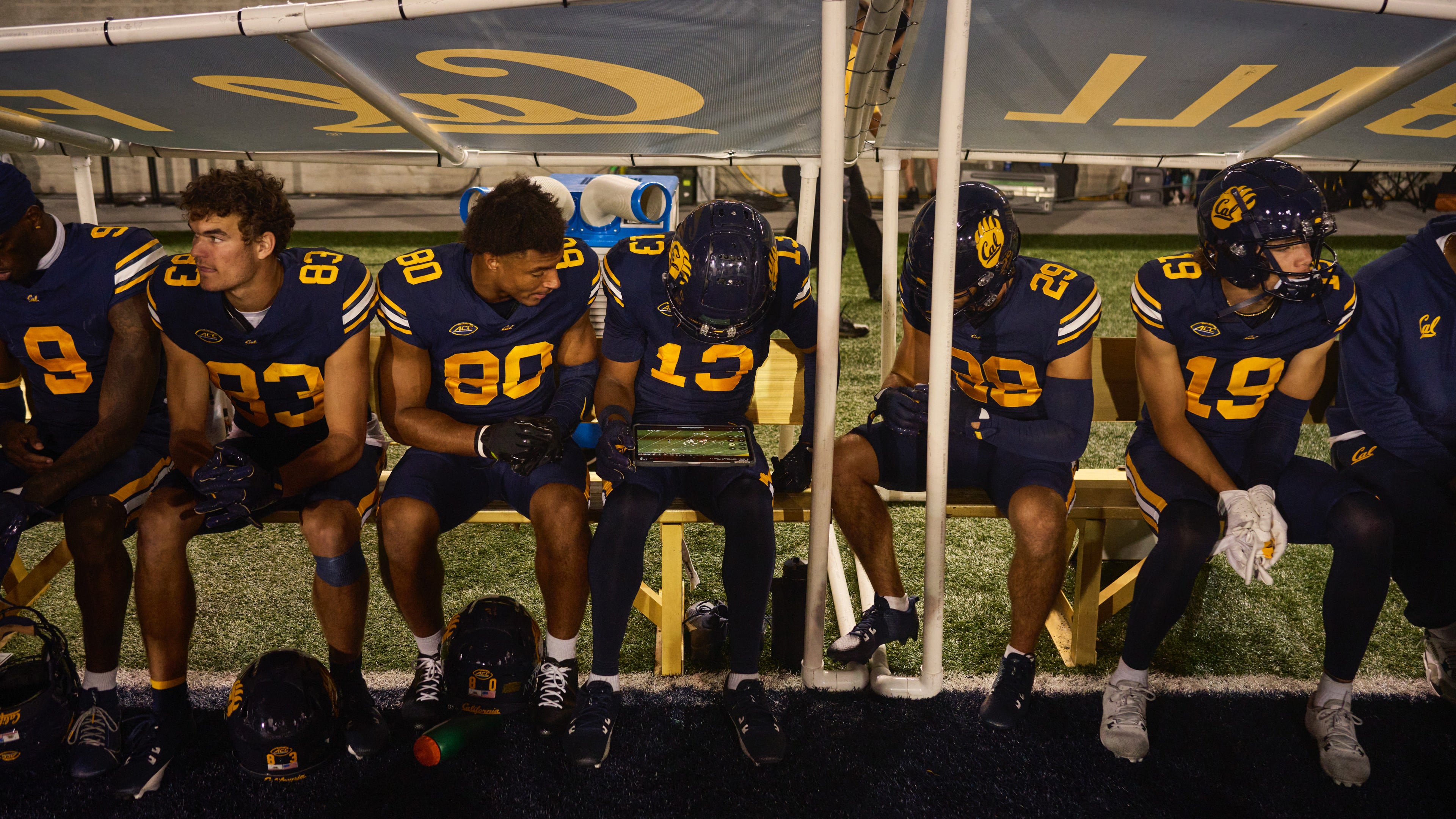 Cal’s starting quarterback, Fernando Mendoza, credits having iPad on the sideline with helping player development in real time. Above, his teammates review video during a game against Miami.| Image credit – Apple - The iPad Pro&#039;s role in a new era of college football: it&#039;s all about strategy and precision