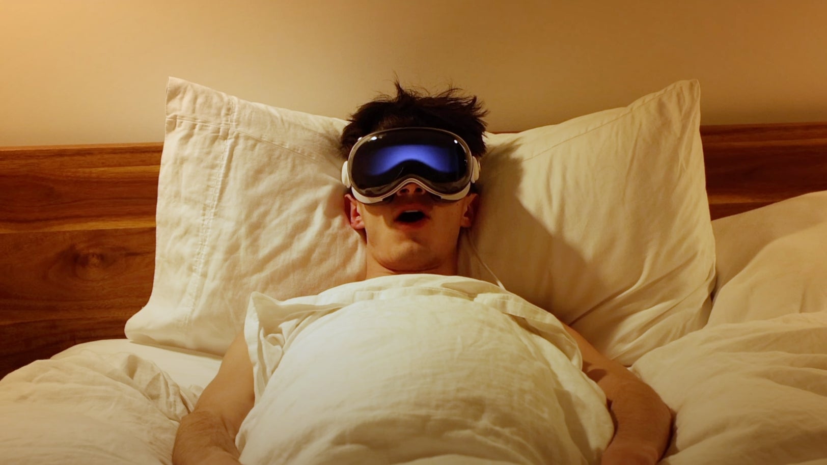 Wearing Apple Vision Pro in bed.