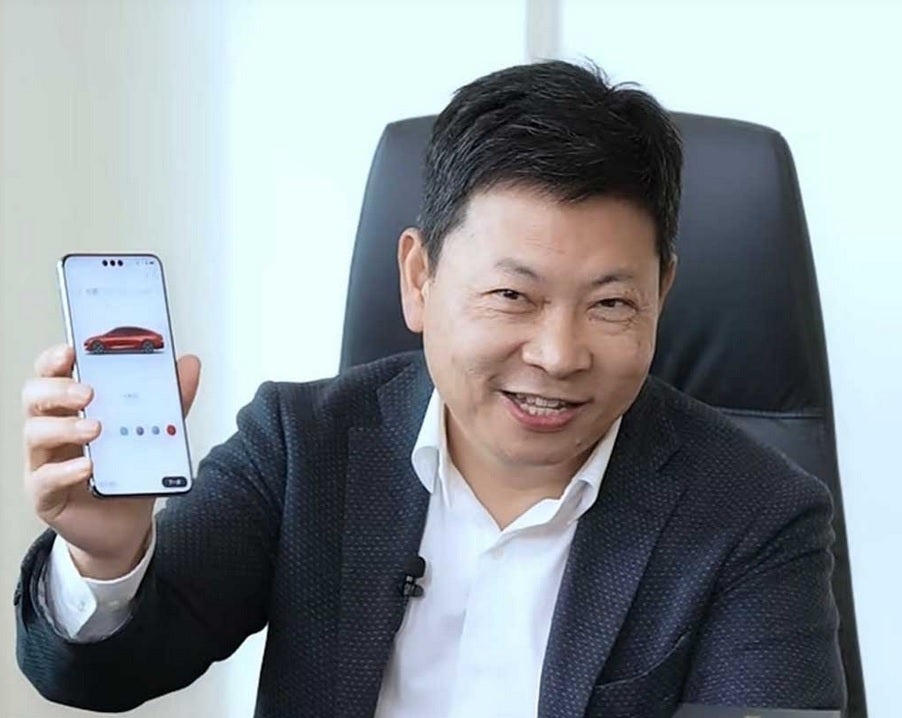 Huawei&amp;#039;s Yu shows off the front of the Mate 70 Pro+ with its unique triple cutout camera.