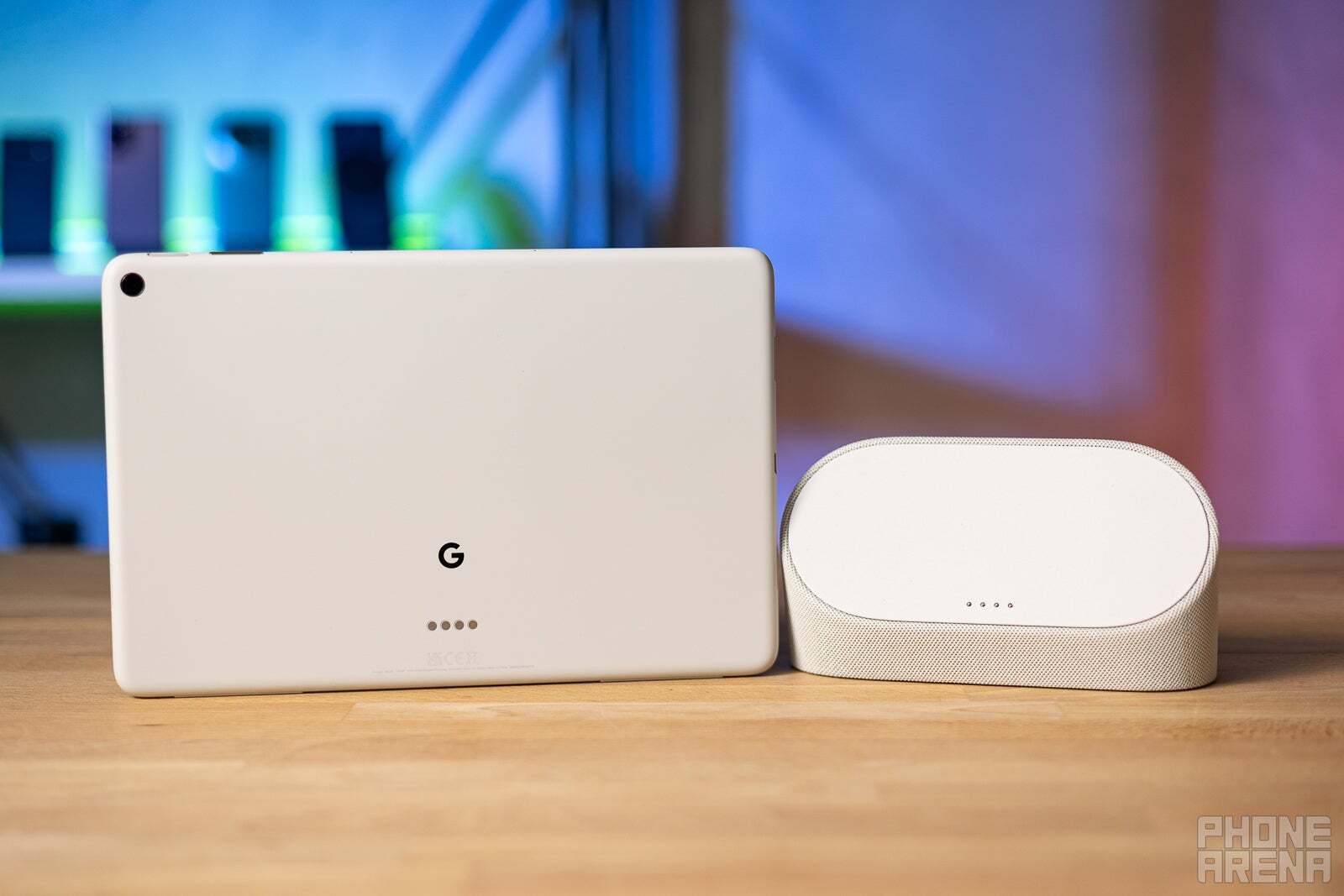 Google Pixel Tablet in white with its charging dock next to it. 